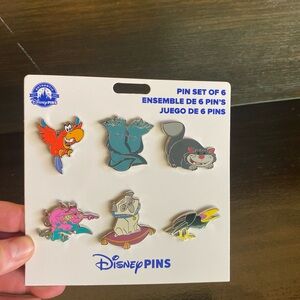 Disney Parks Villains Sidekicks Booster Set of 6 Pins in hand BNWT